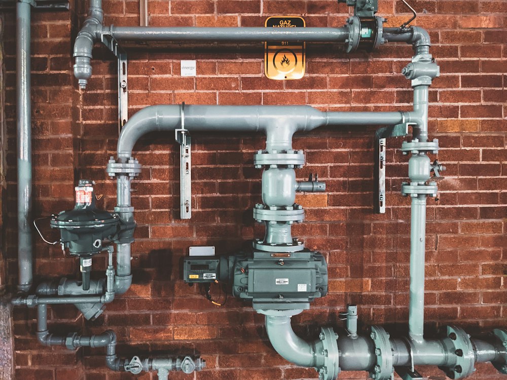 Exposed plumbing pipes ready for a remodel